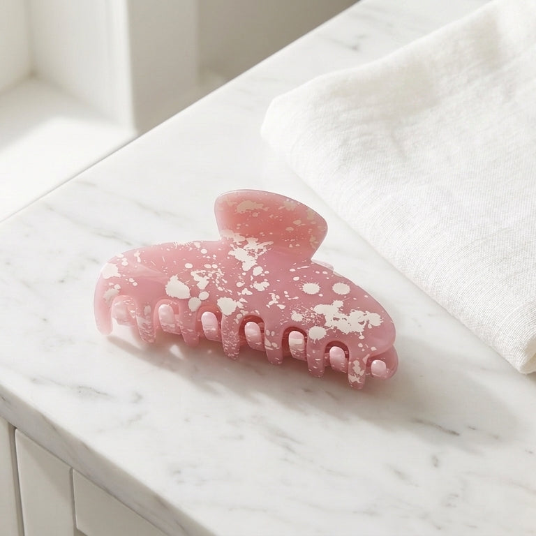 Blush pink acetate hair claw clip with white paint splatter design by bymehshake