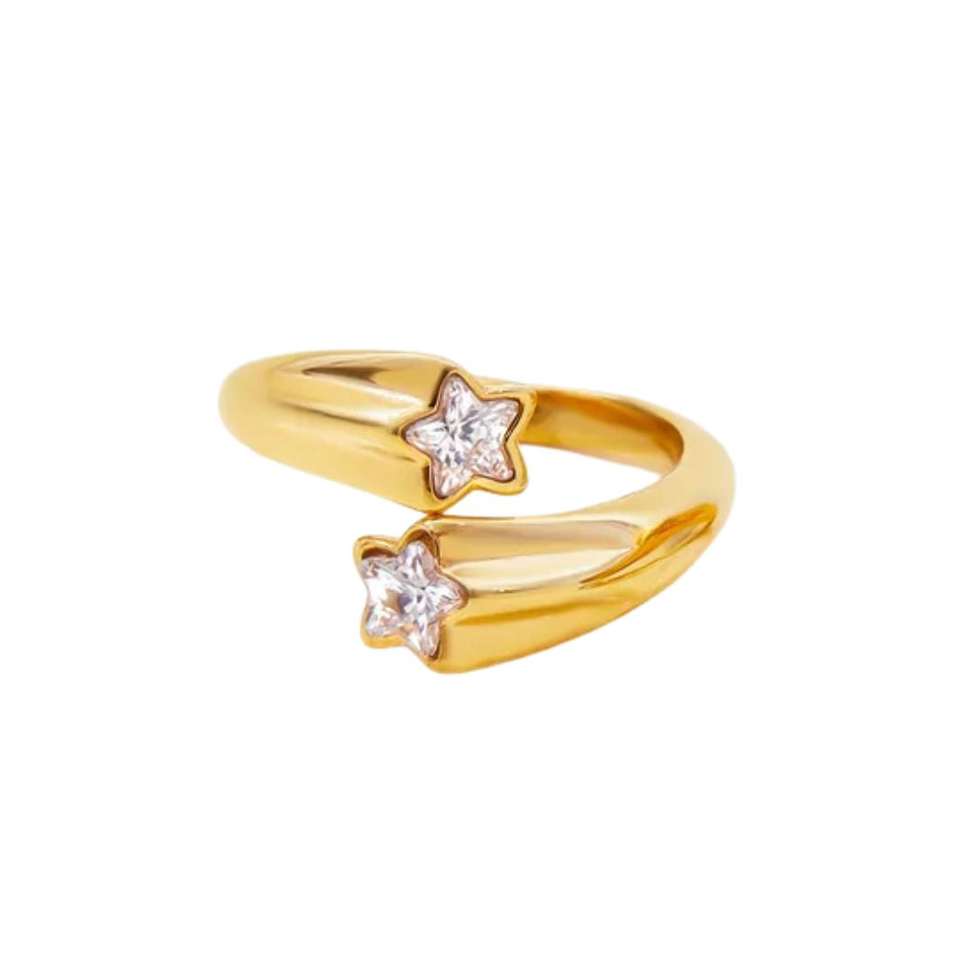 Gold ring with star-shaped diamond stones on a white background