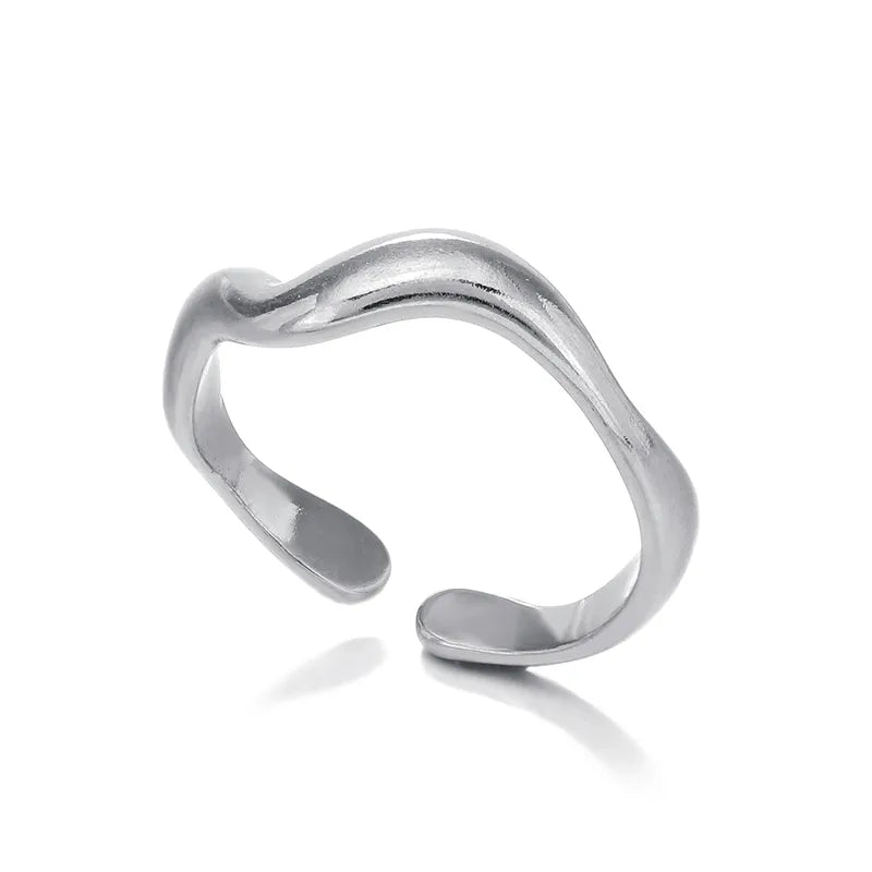 Silver curvy ring on a white background