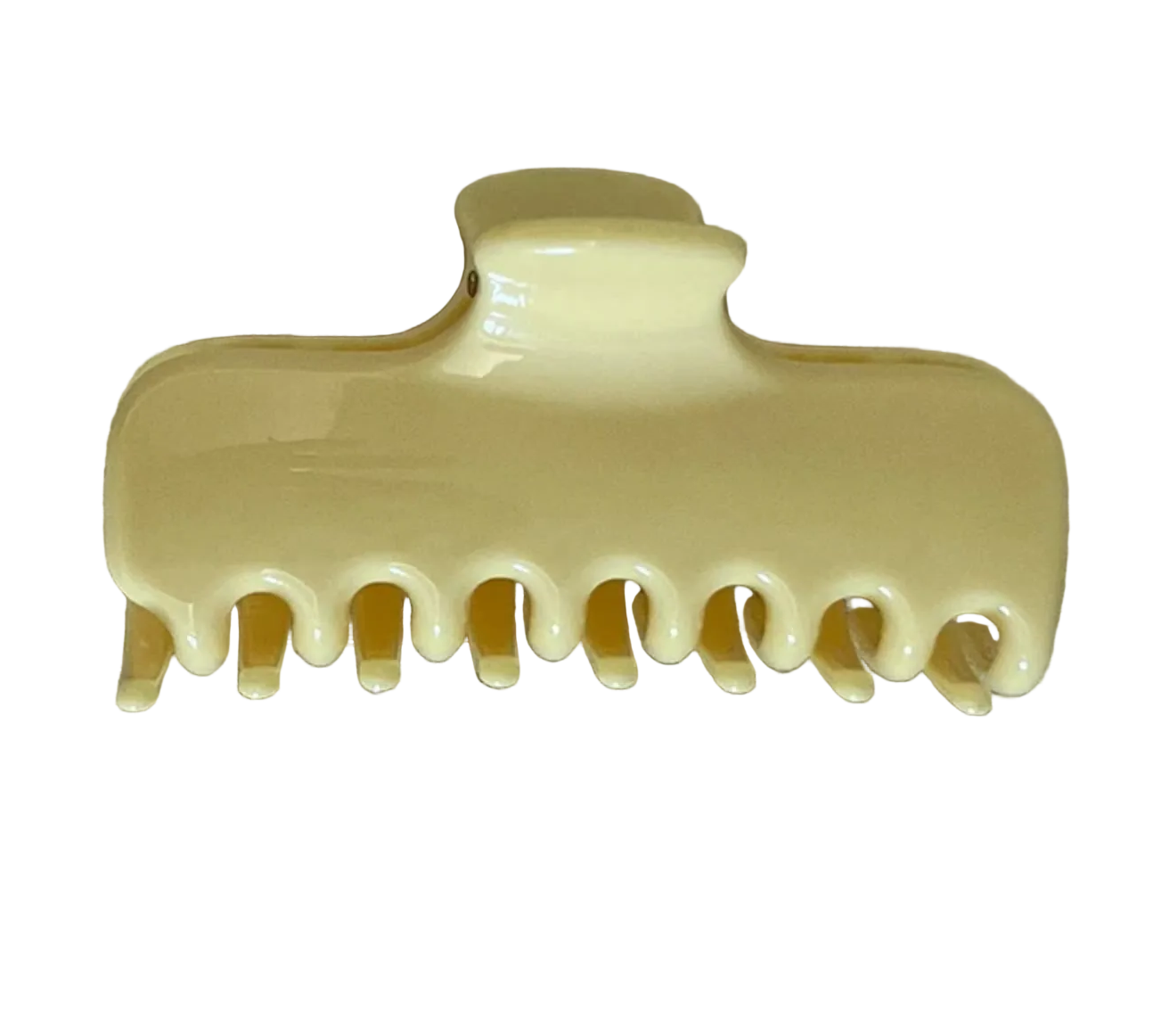 A glossy cream-colored hair claw clip resting on a textured beige fabric background.