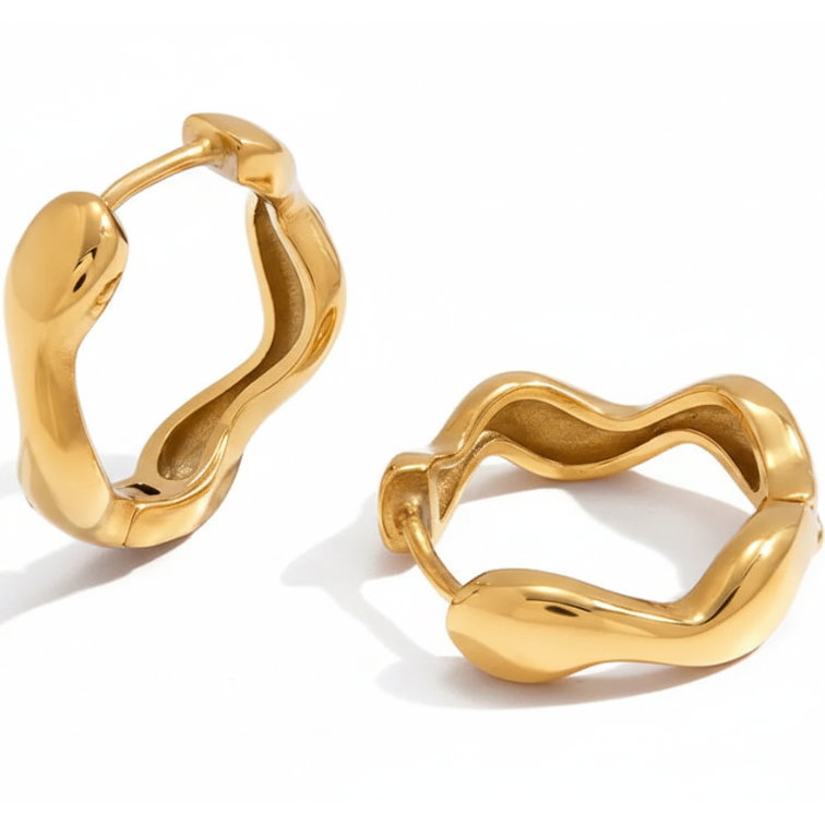 Gold wavy hoop earrings on a white background