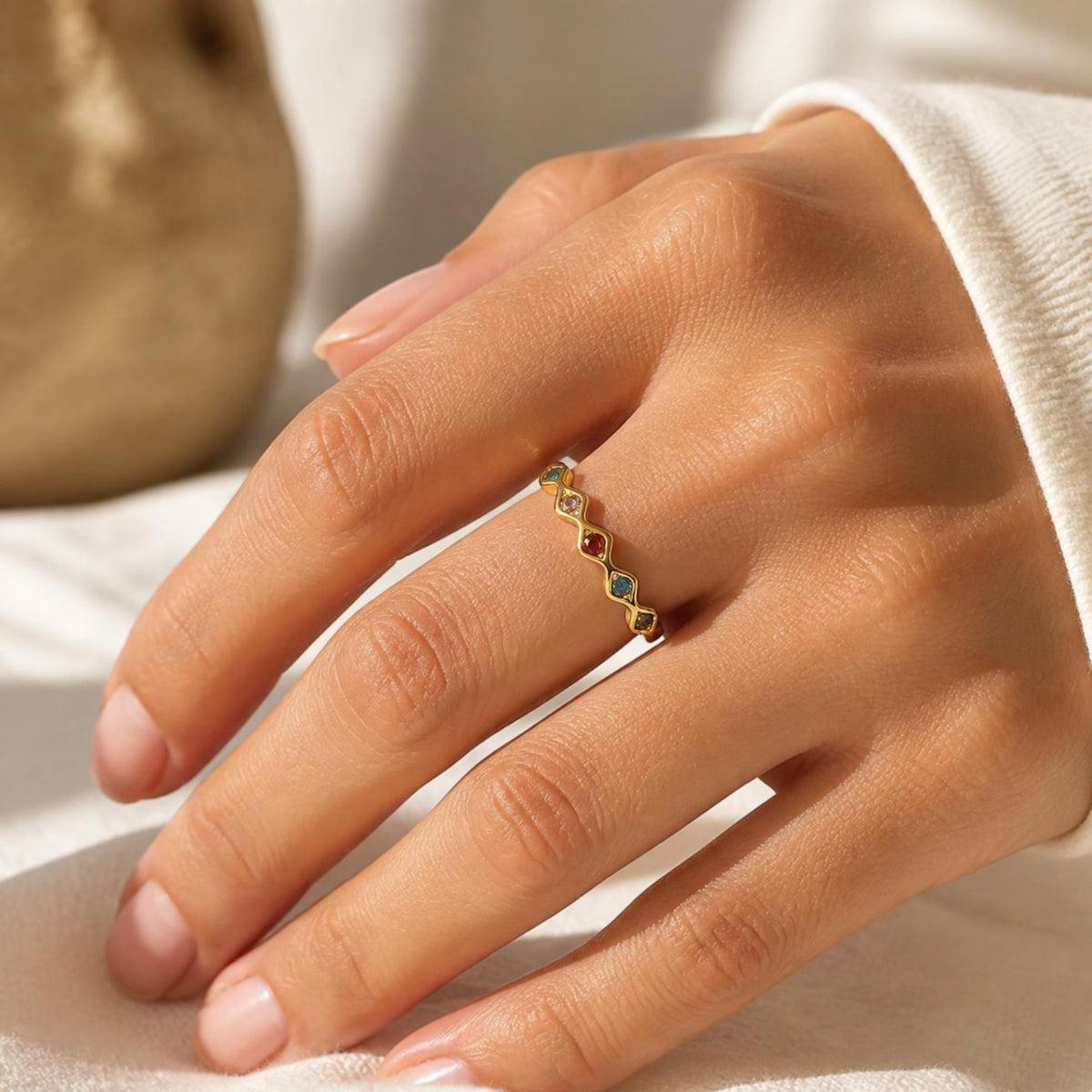 Gold ring worn on a hand