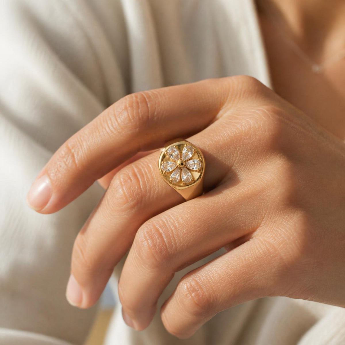 Flower Signet Ring worn on finger, showing the five-petal clear crystal flower