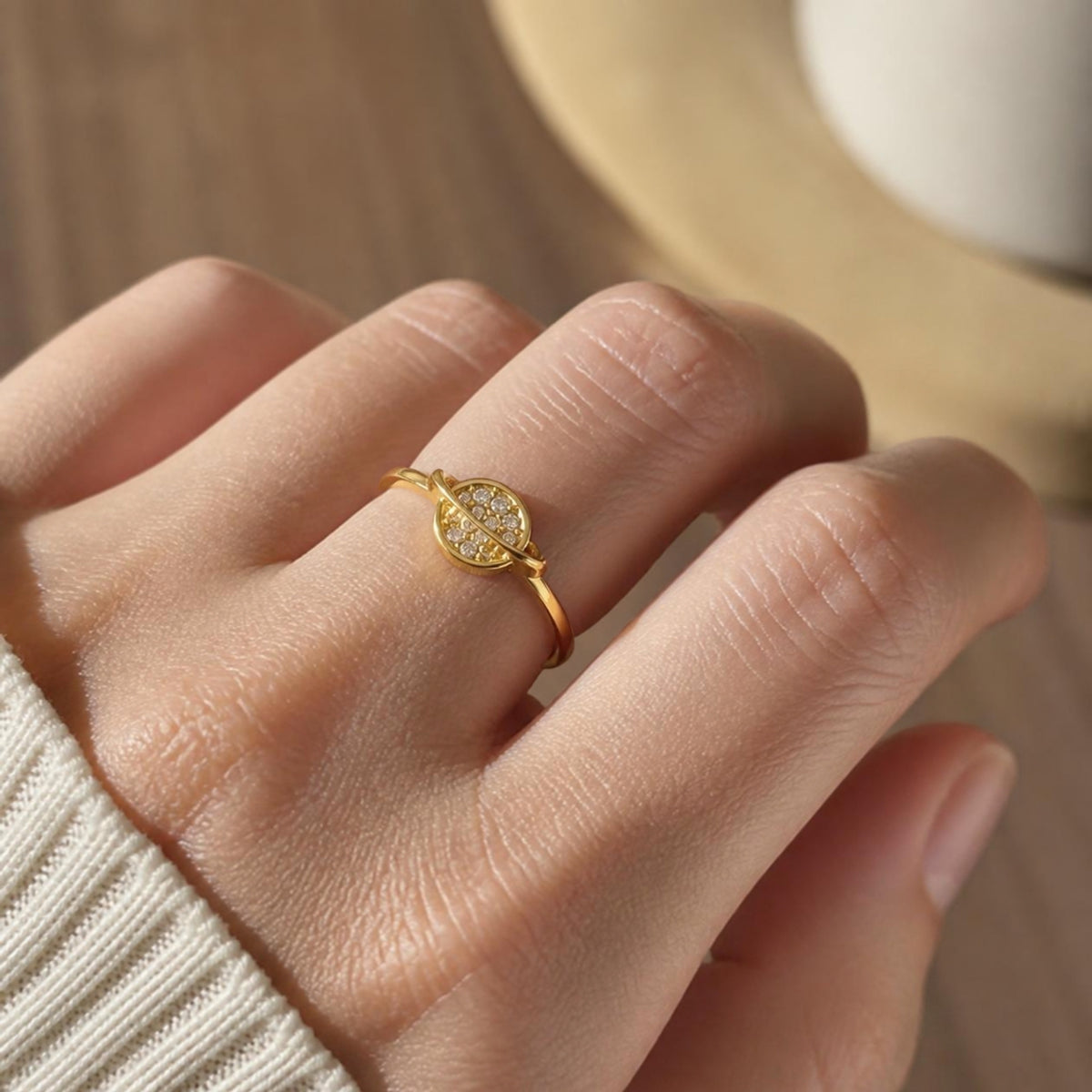 Planet Ring worn on finger, showing the round pave crystal disc face