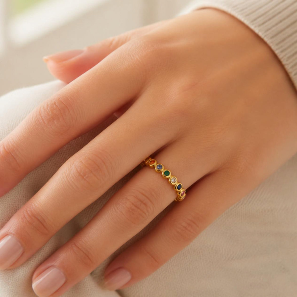 Gold ring worn on a hand