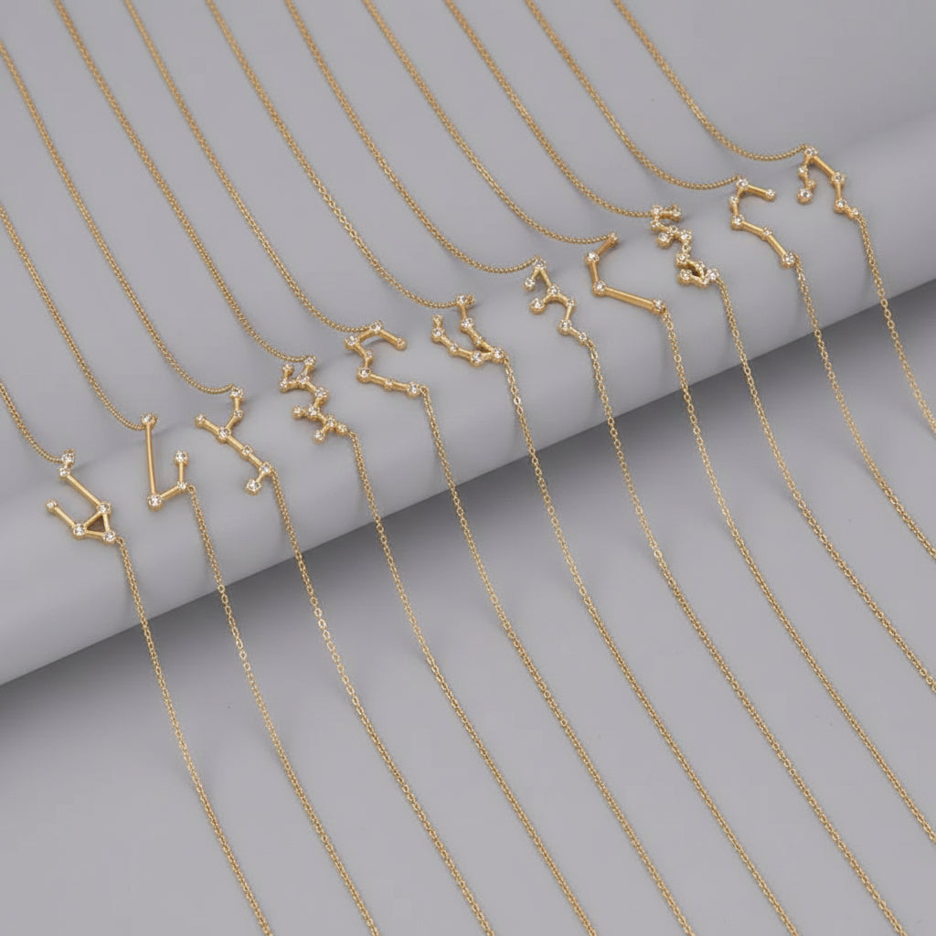 Gold necklaces with zodiac signs on a black background