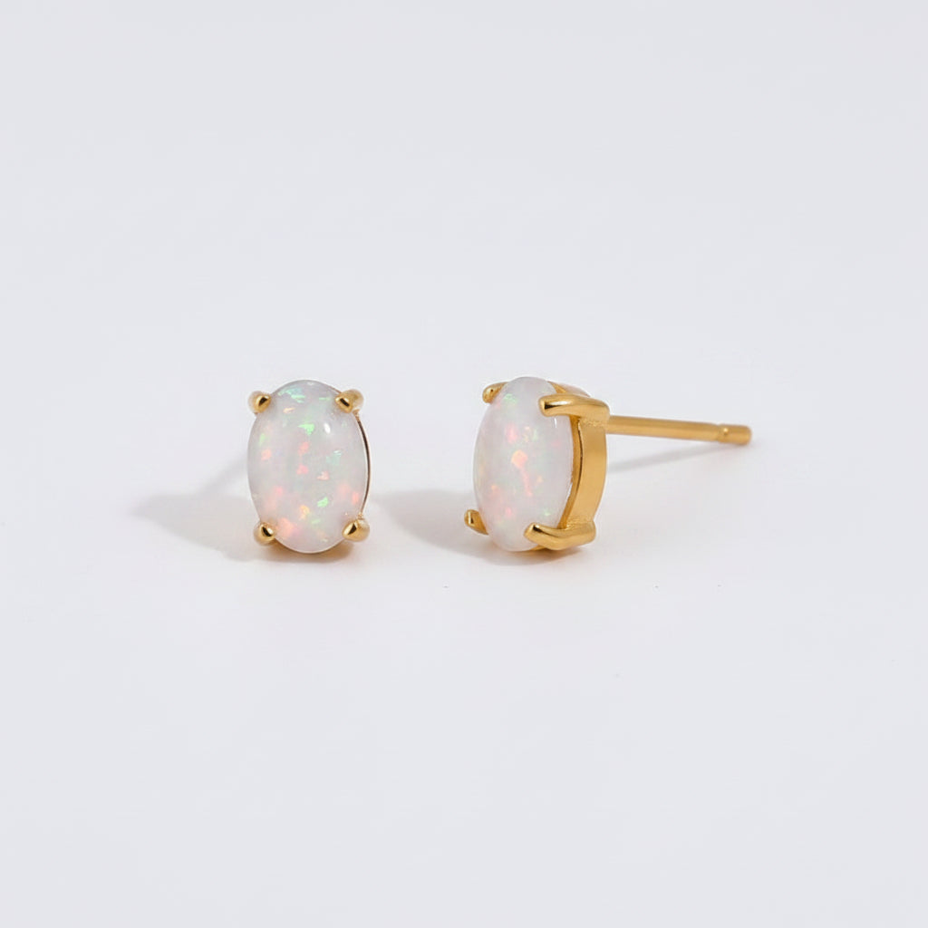 Opal earrings with gold setting, showing measurements and material details on a white background.