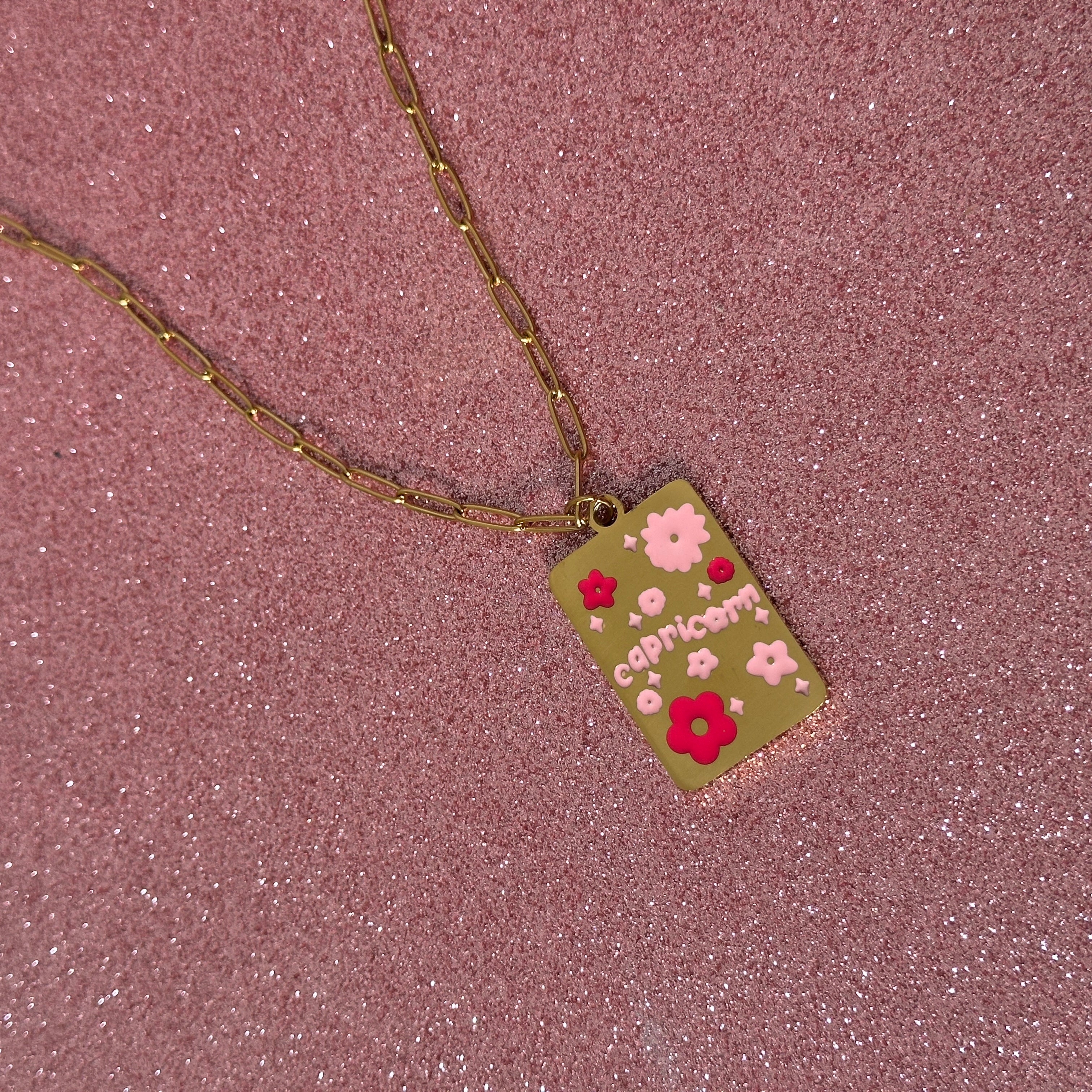 pink star sign necklace