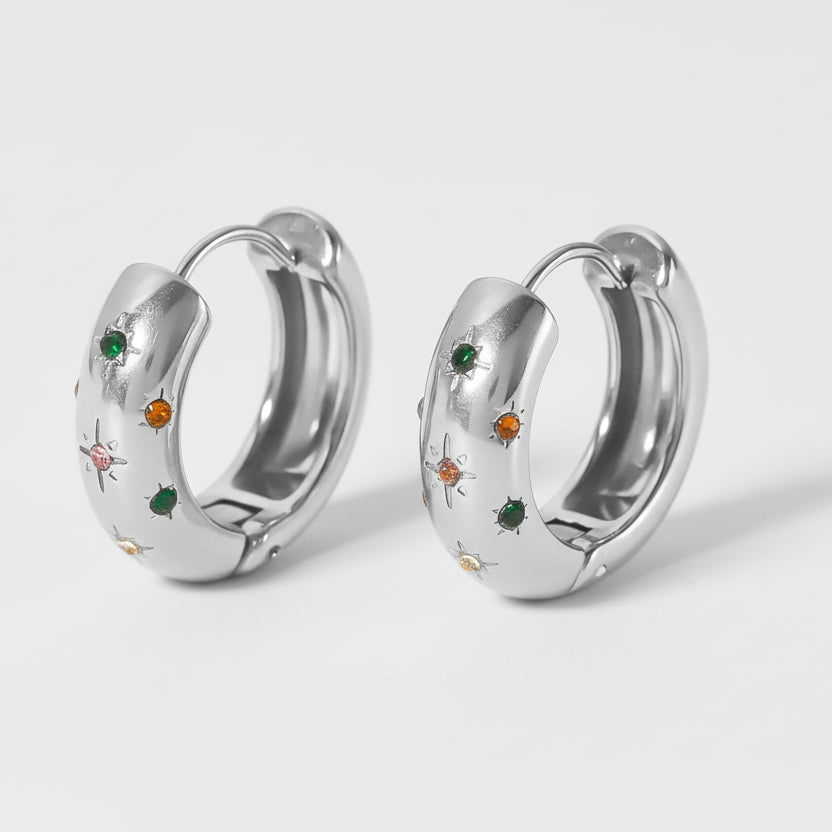 Silver hoop earrings with colorful stones, shown on a white background.