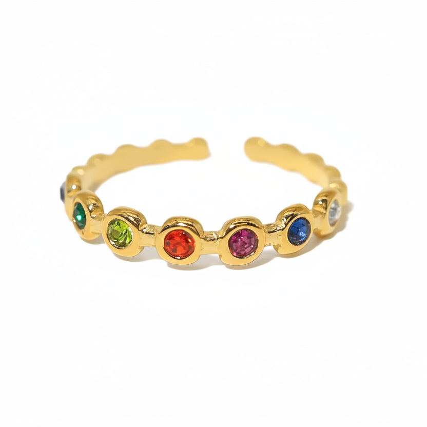 Gold ring with colored crystals and product details on a white background