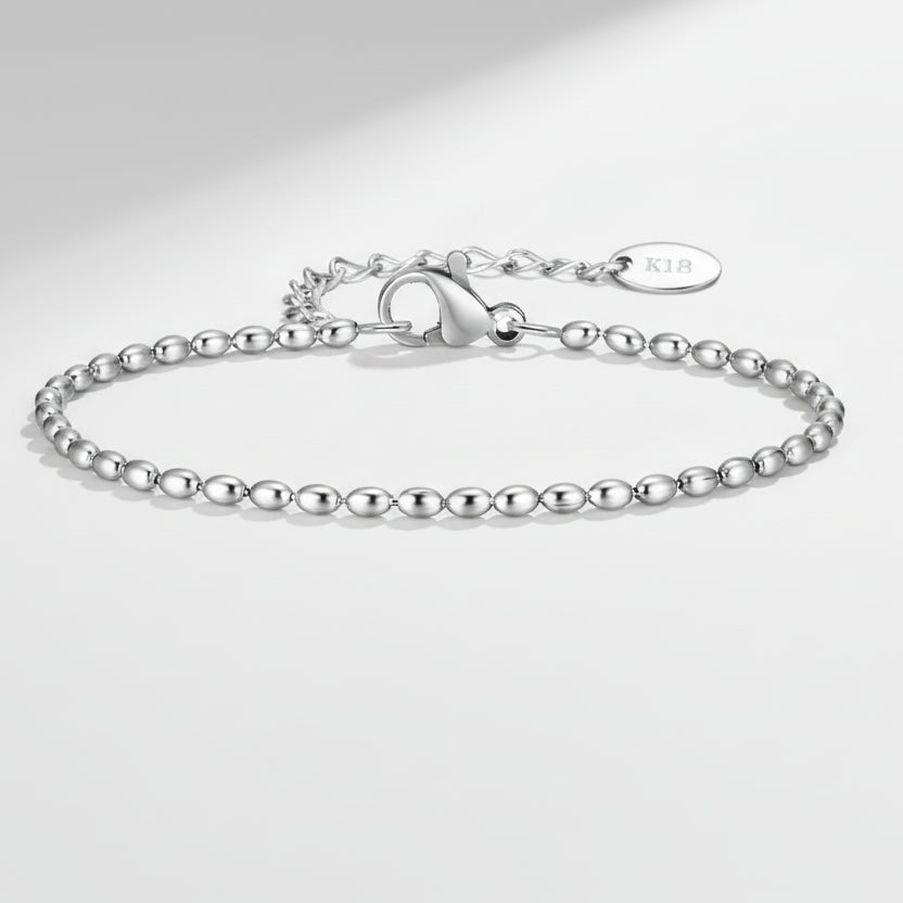 Silver bracelet with chain design on a white background