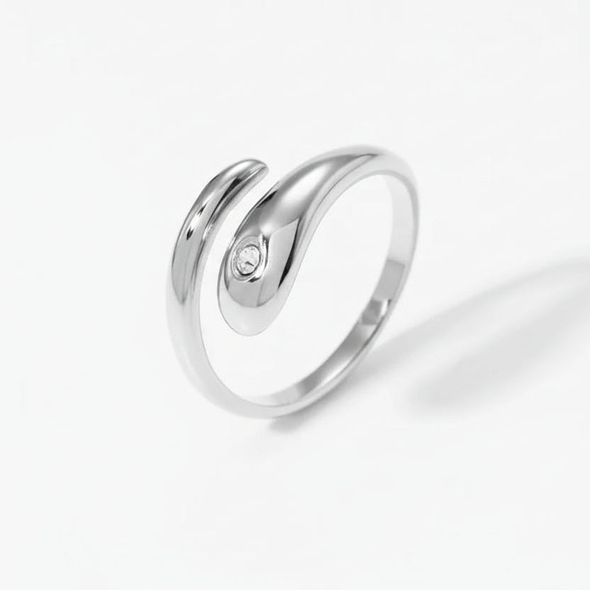 Silver ring with a small diamond on a white background