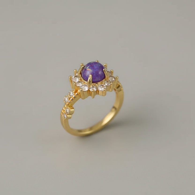 Gold ring with a purple gemstone 