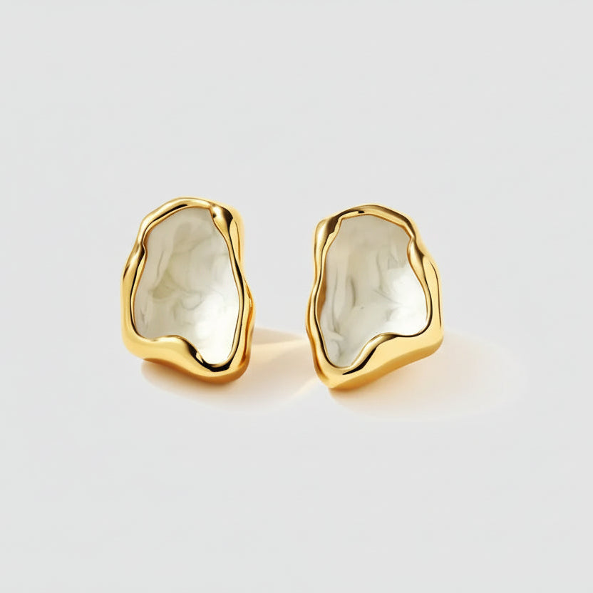 Gold earrings with white stone centers