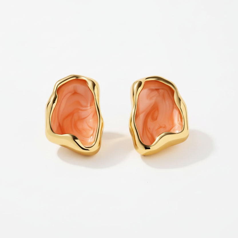 Gold earrings with orange stones, showing measurements and material details on a white background.