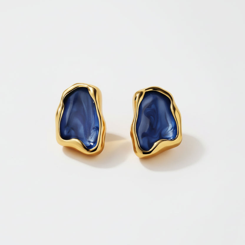 Gold earrings with blue stone design, shown with measurements and material information on a white background.