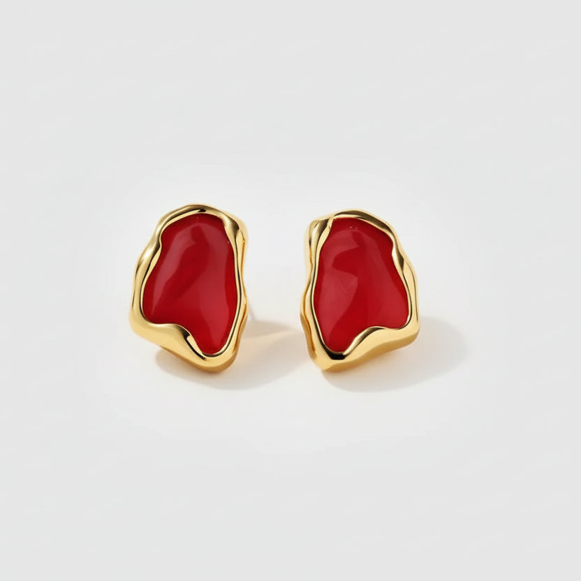 Gold earrings with red stones, showing measurements and material details on a white background.