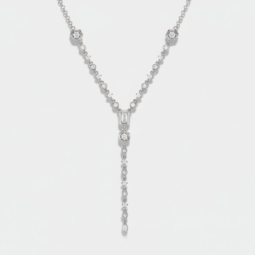 Silver necklace with gemstones on a light gray background