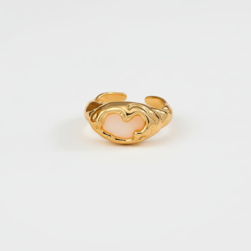Gold ring with a white abalone stone 