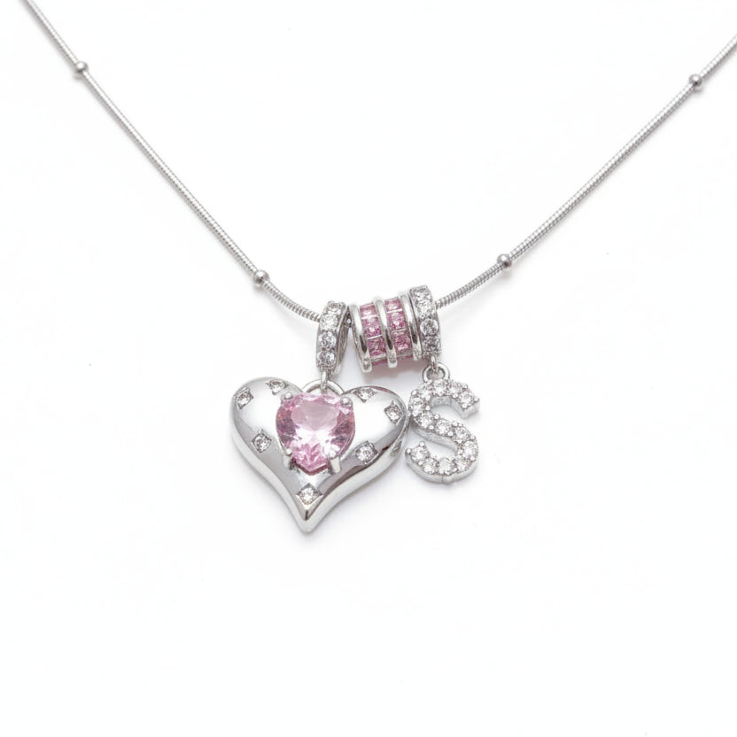 Silver necklace with pink heart-shaped and letter charms 