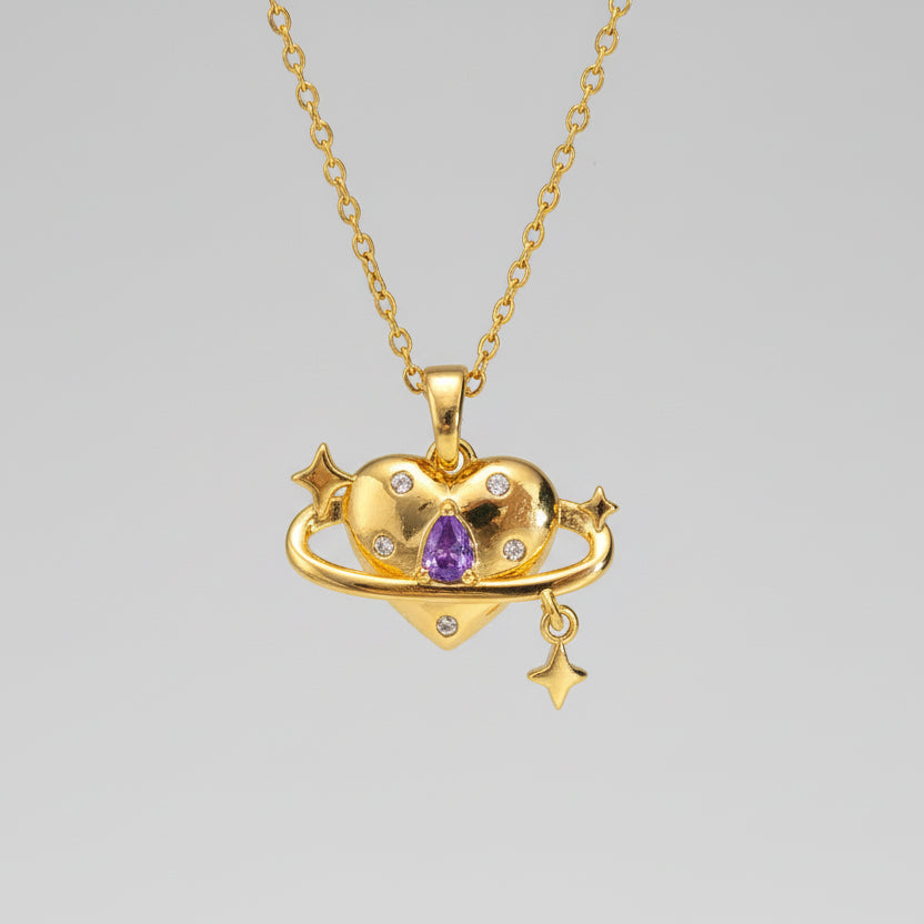 Gold necklace with a heart-shaped pendant featuring a purple gemstone on a white background