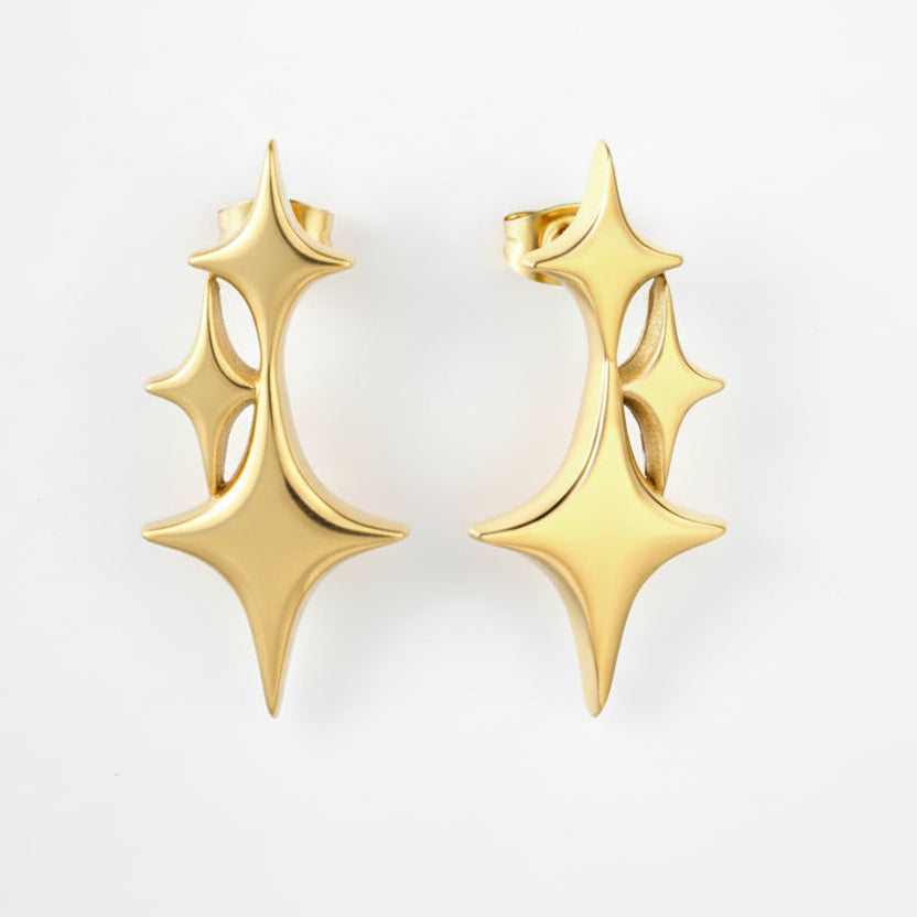 Gold earrings with geometric design on a white background