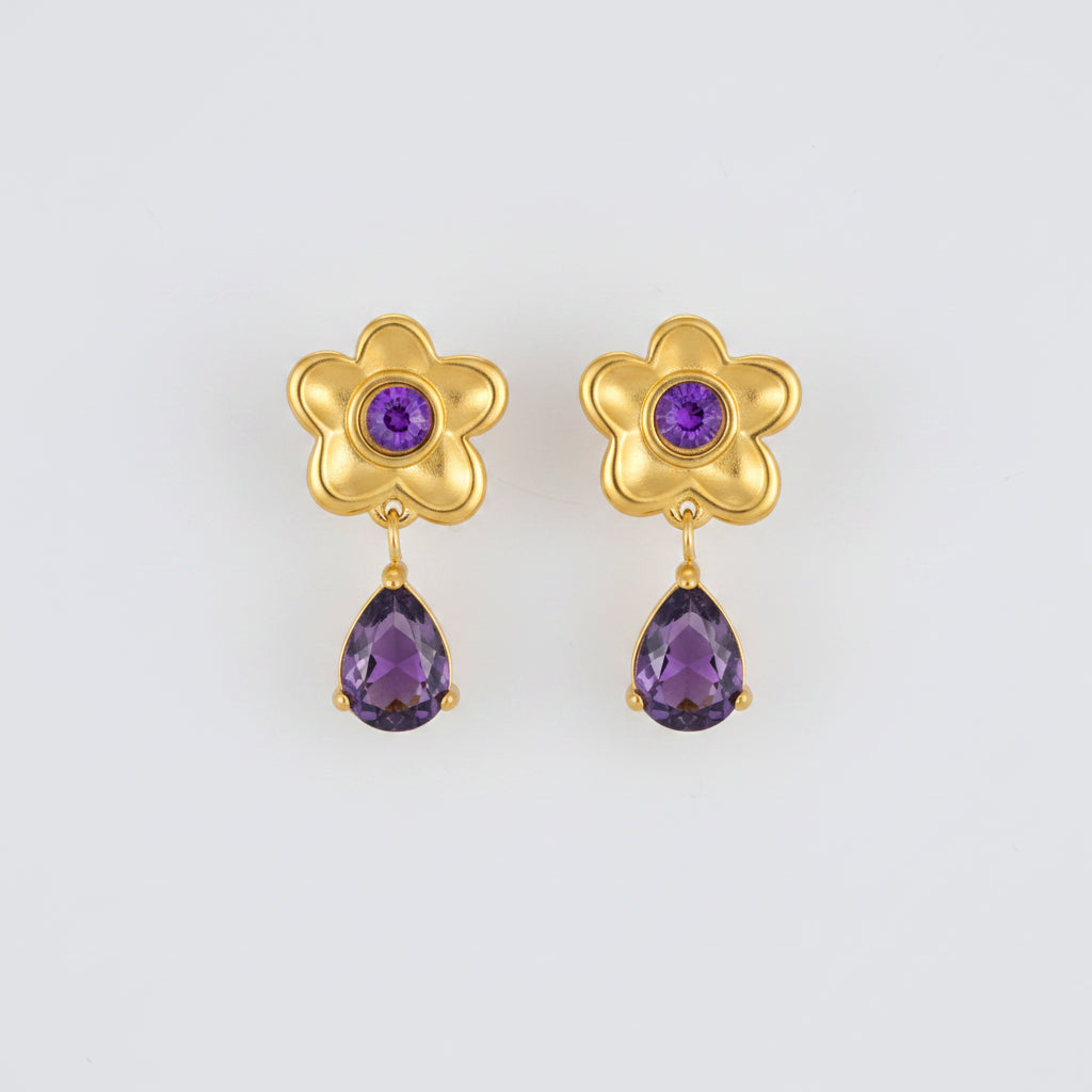 Gold flower-shaped earrings with purple gemstones and measurements on a white background