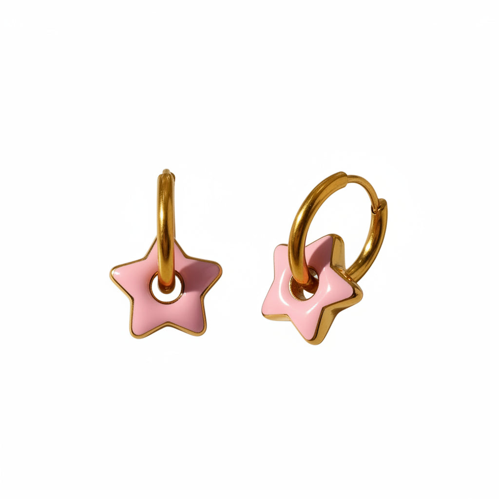 Pair of gold hoop earrings with pink star-shaped ends on a light background
