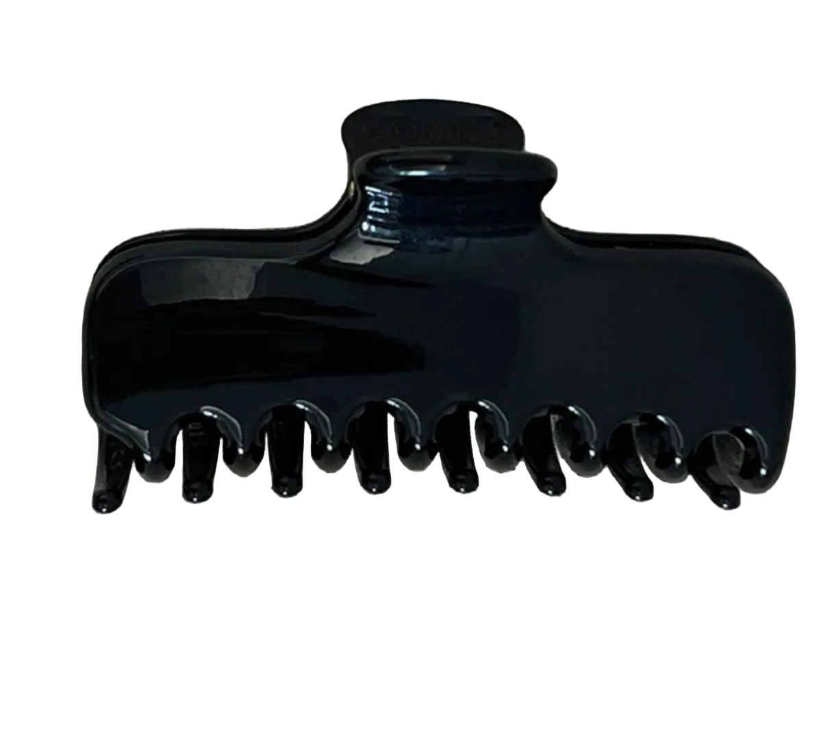 A glossy black hair claw clip placed on a textured beige fabric background.